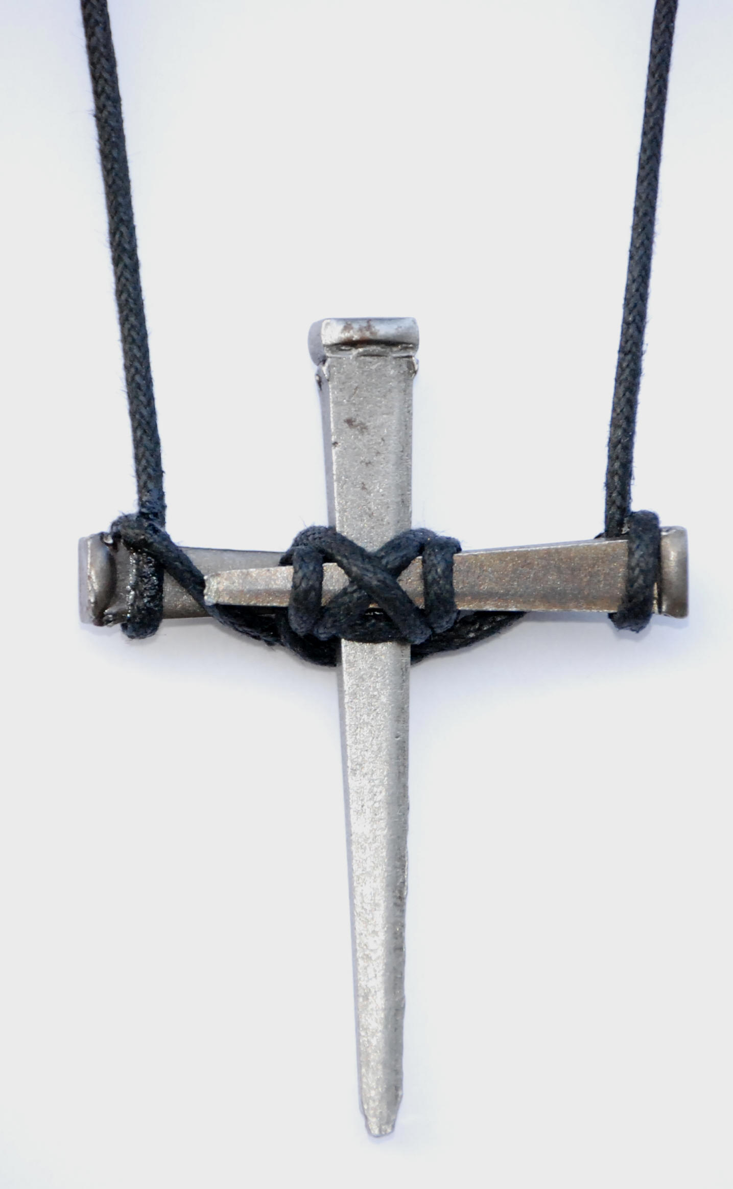 Handmade three-nail cross with black cord